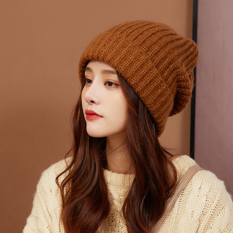 Small Knitted Ear Flap Cap Pile